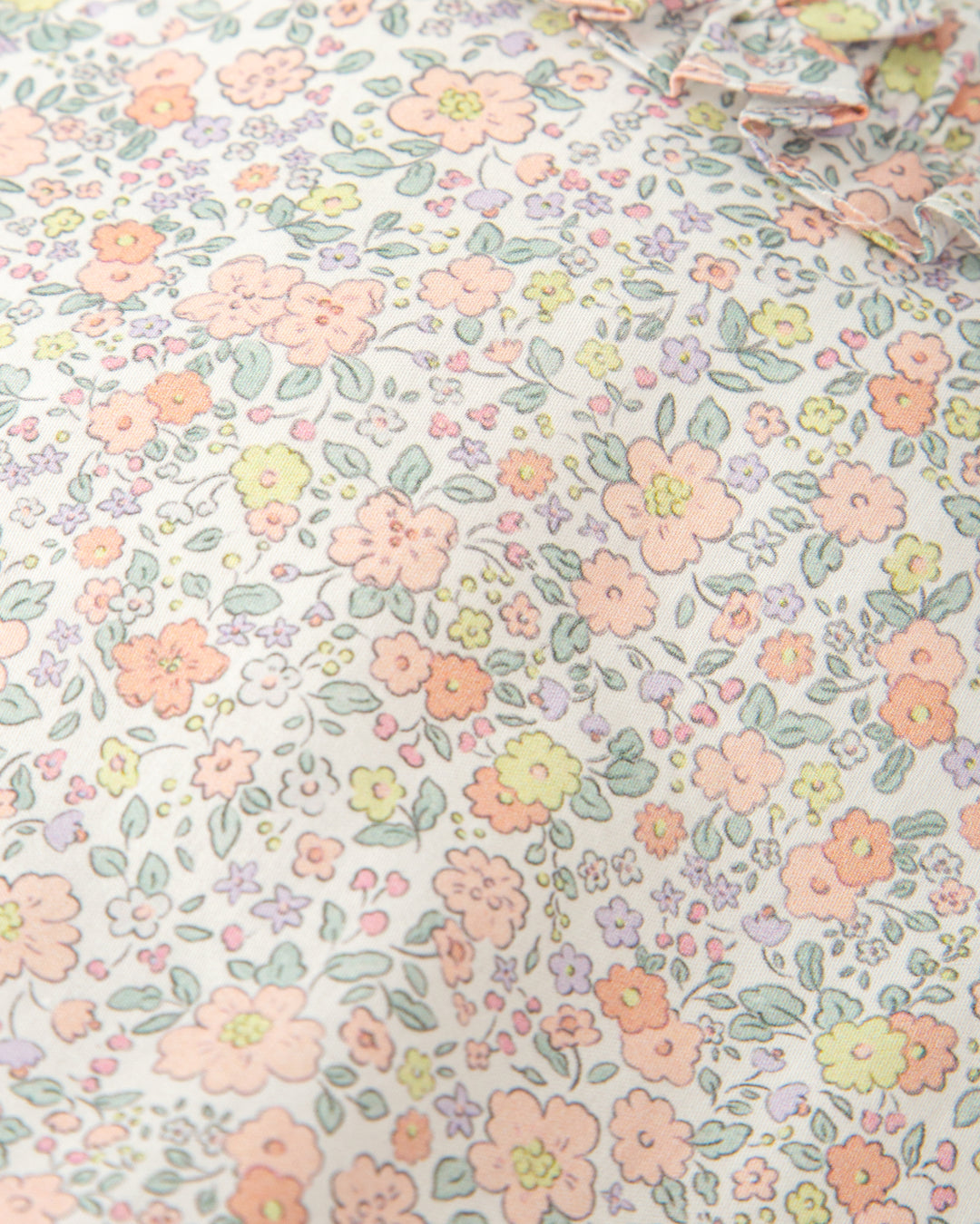 PELELE CORTO SIN MANGAS FLORES PÉTALO